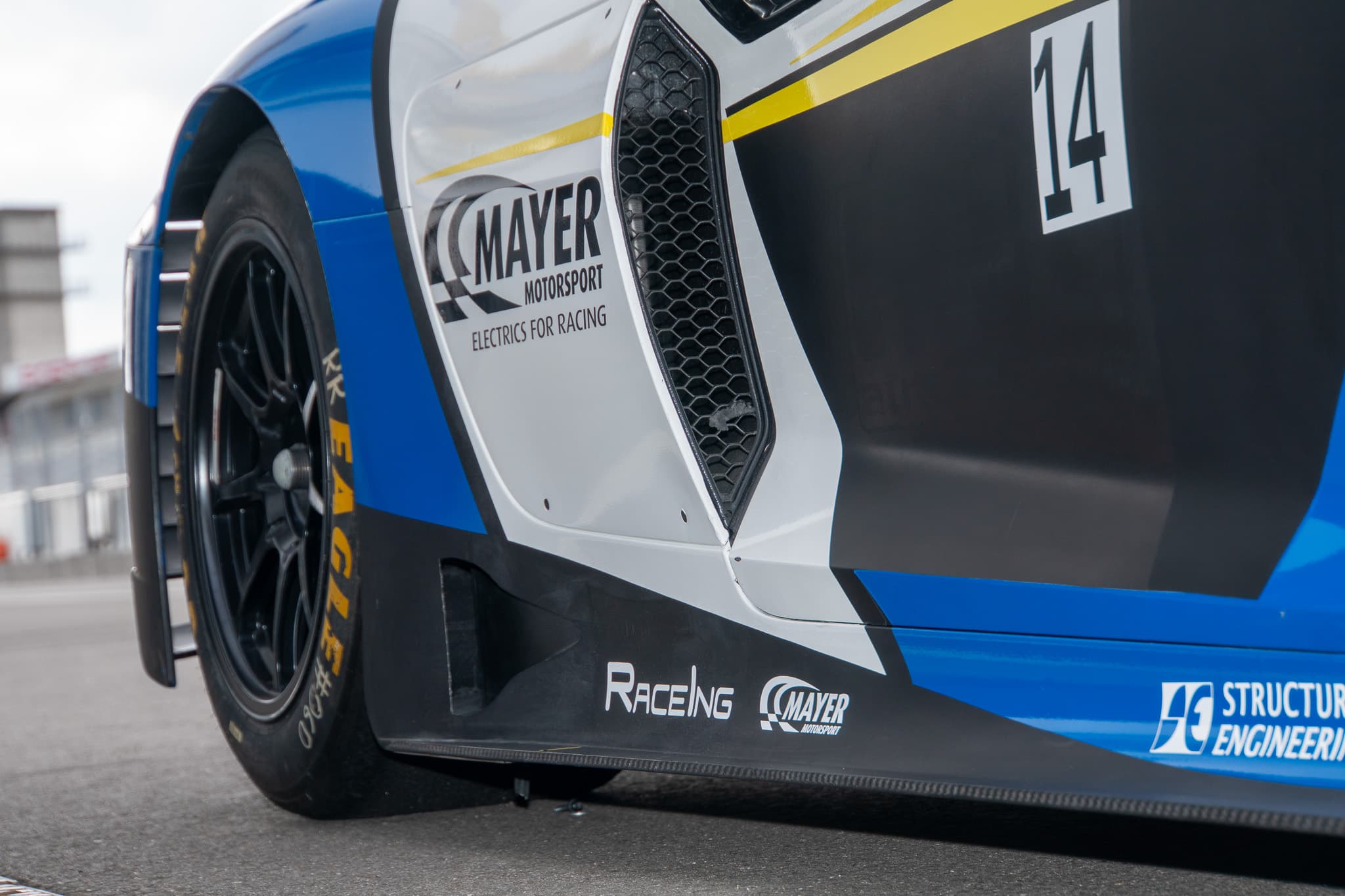 Partner branding on the flank of the race car